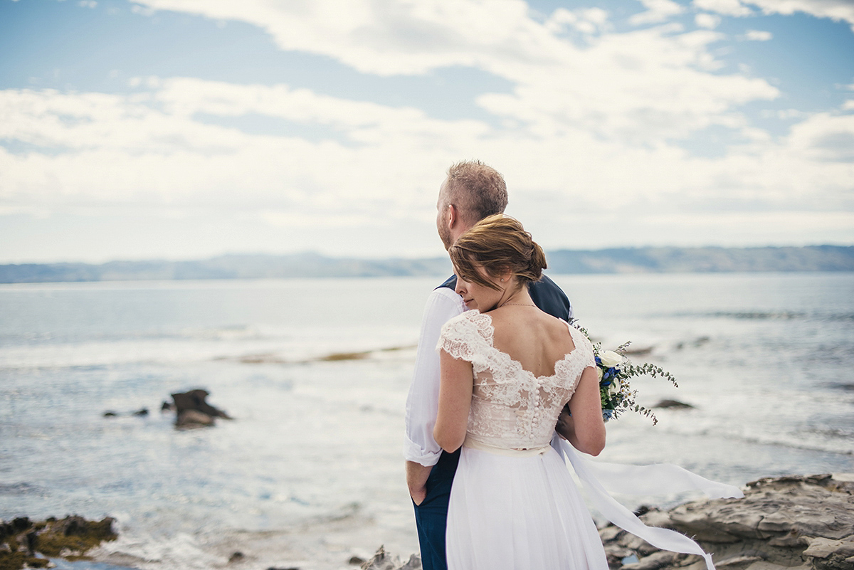 Suzy wore a stunning ombre/dip dye dress for her barefoot beach wedding in New Zealand. Photography by Meredith Lord.