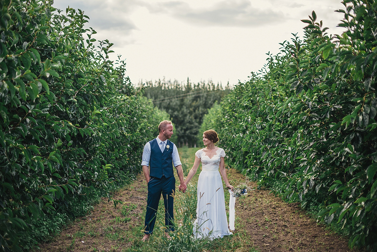 Suzy wore a stunning ombre/dip dye dress for her barefoot beach wedding in New Zealand. Photography by Meredith Lord.