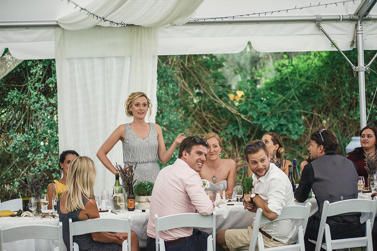 Suzy wore a stunning ombre/dip dye dress for her barefoot beach wedding in New Zealand. Photography by Meredith Lord.