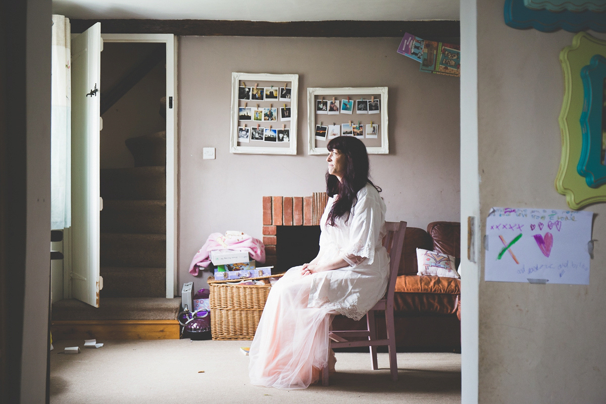 Fran wore a bohemian lace dress for her festival inspired vow renewal held in a meadow. Photography by Joshua Patrick.