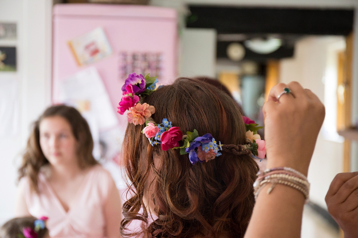 Fran wore a bohemian lace dress for her festival inspired vow renewal held in a meadow. Photography by Joshua Patrick.