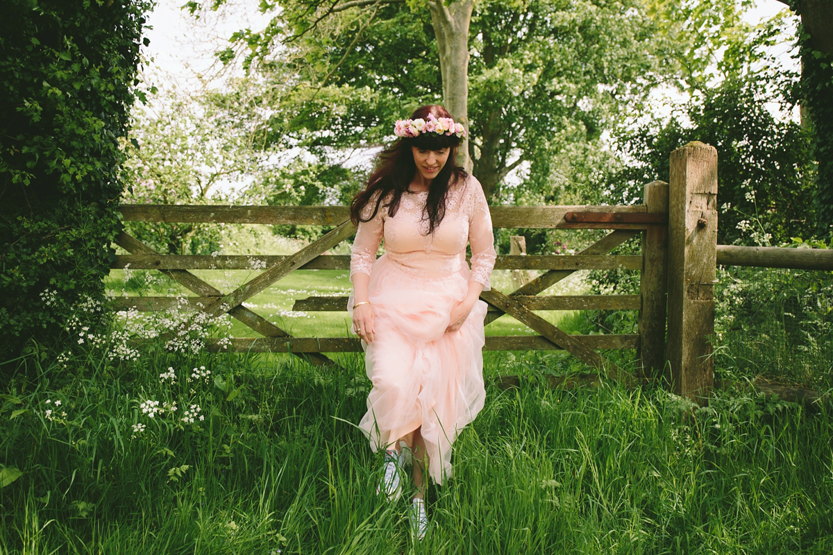 Fran wore a bohemian lace dress for her festival inspired vow renewal held in a meadow. Photography by Joshua Patrick.