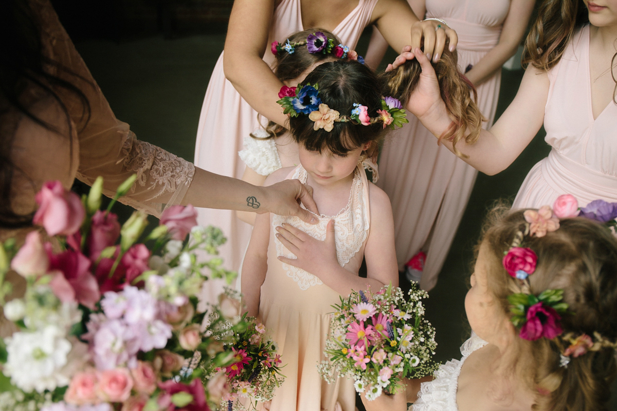 Fran wore a bohemian lace dress for her festival inspired vow renewal held in a meadow. Photography by Joshua Patrick.