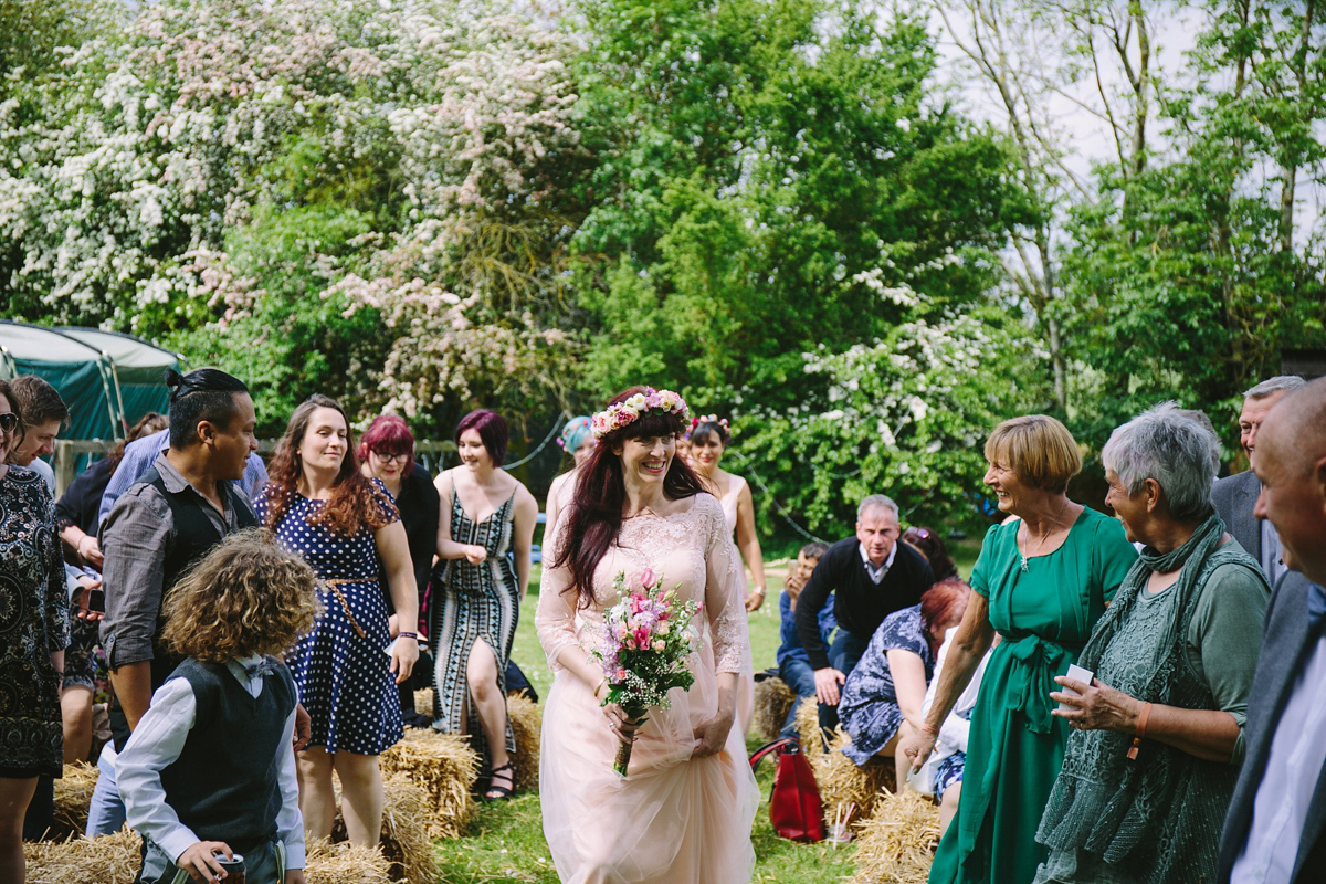 Fran wore a bohemian lace dress for her festival inspired vow renewal held in a meadow. Photography by Joshua Patrick.