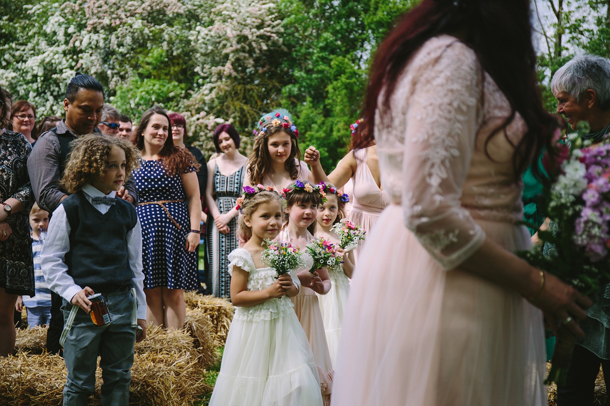 Fran wore a bohemian lace dress for her festival inspired vow renewal held in a meadow. Photography by Joshua Patrick.