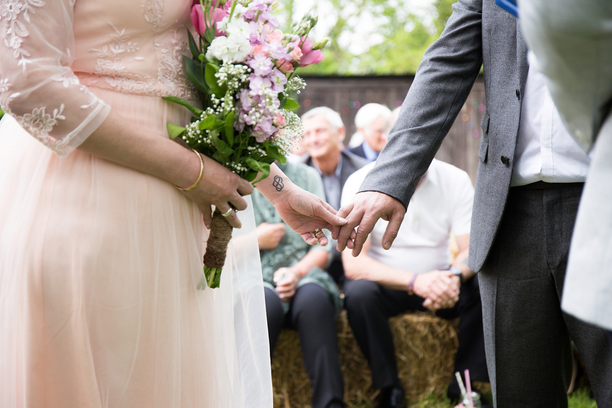 Fran wore a bohemian lace dress for her festival inspired vow renewal held in a meadow. Photography by Joshua Patrick.