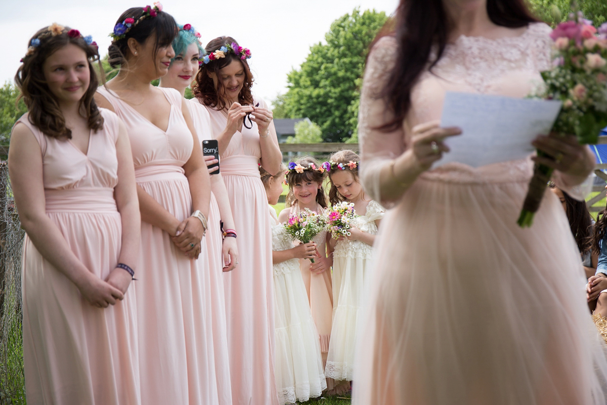 Fran wore a bohemian lace dress for her festival inspired vow renewal held in a meadow. Photography by Joshua Patrick.