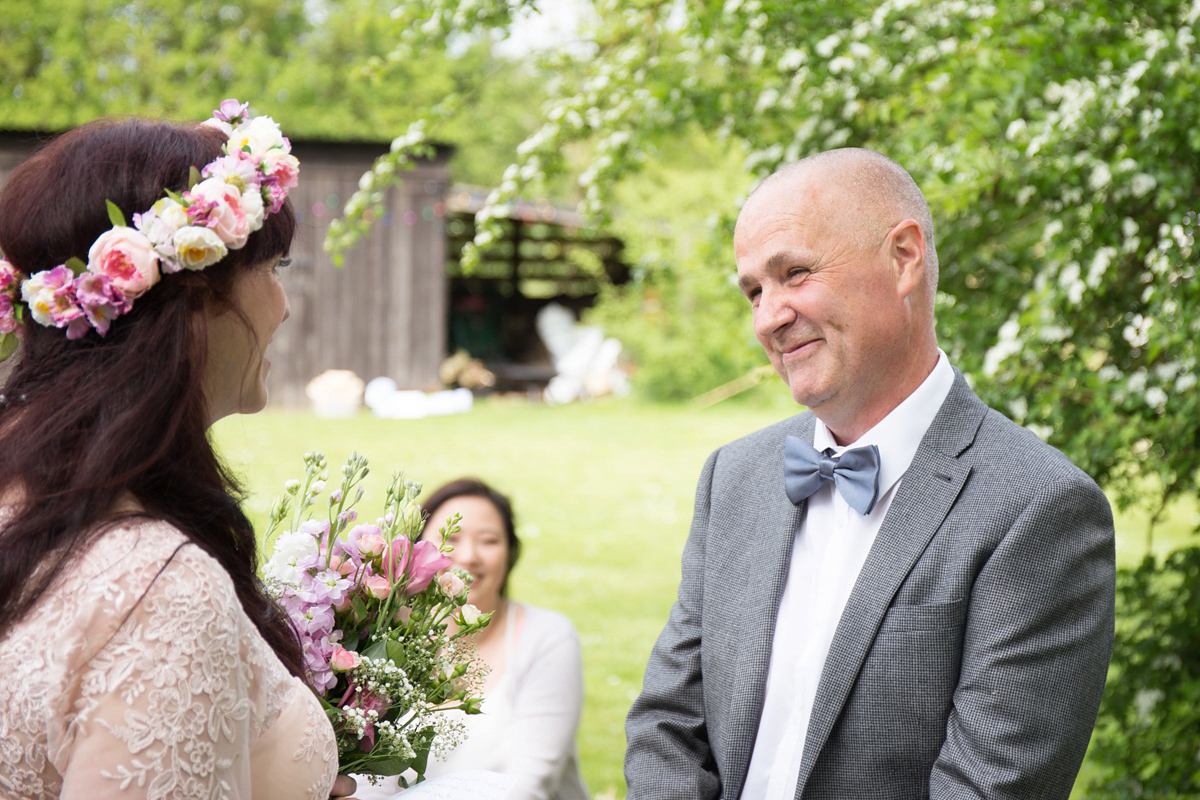 Fran wore a bohemian lace dress for her festival inspired vow renewal held in a meadow. Photography by Joshua Patrick.