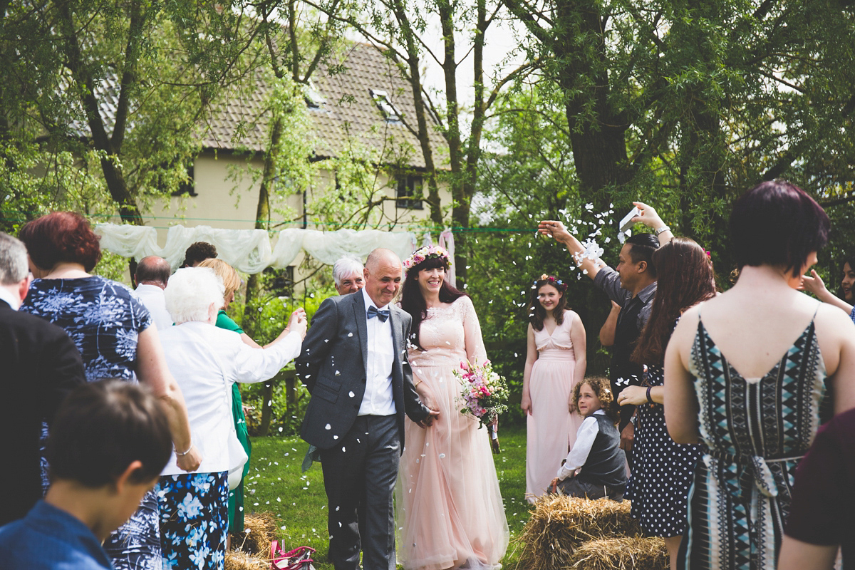 Fran wore a bohemian lace dress for her festival inspired vow renewal held in a meadow. Photography by Joshua Patrick.