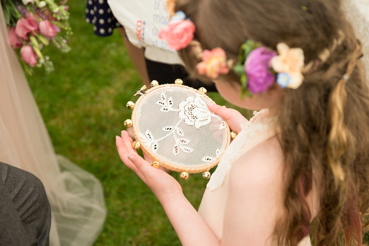 Fran wore a bohemian lace dress for her festival inspired vow renewal held in a meadow. Photography by Joshua Patrick.