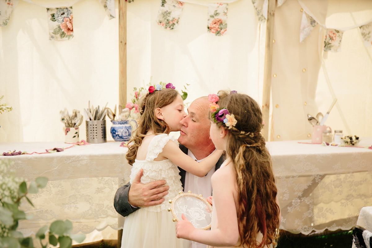 Fran wore a bohemian lace dress for her festival inspired vow renewal held in a meadow. Photography by Joshua Patrick.