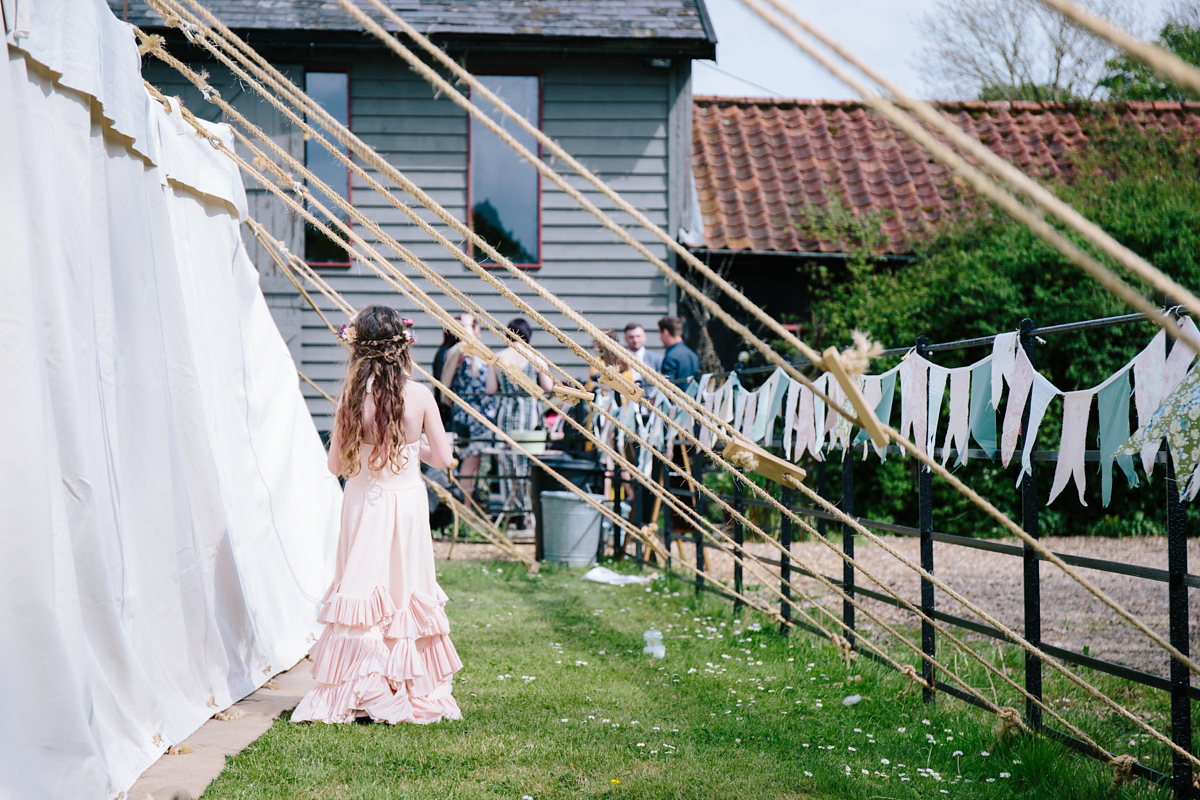 Fran wore a bohemian lace dress for her festival inspired vow renewal held in a meadow. Photography by Joshua Patrick.