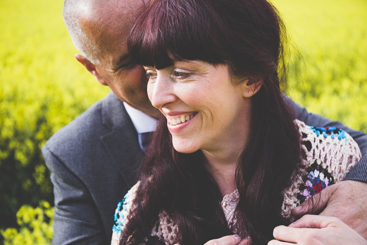 Fran wore a bohemian lace dress for her festival inspired vow renewal held in a meadow. Photography by Joshua Patrick.