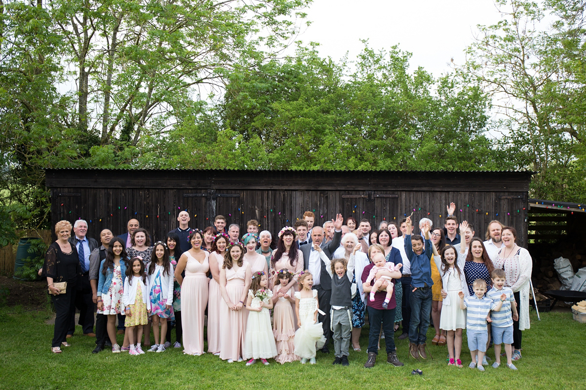 Fran wore a bohemian lace dress for her festival inspired vow renewal held in a meadow. Photography by Joshua Patrick.