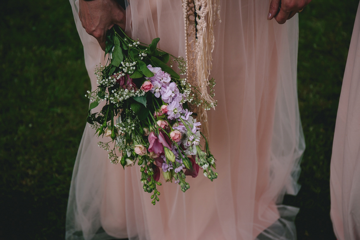 Fran wore a bohemian lace dress for her festival inspired vow renewal held in a meadow. Photography by Joshua Patrick.