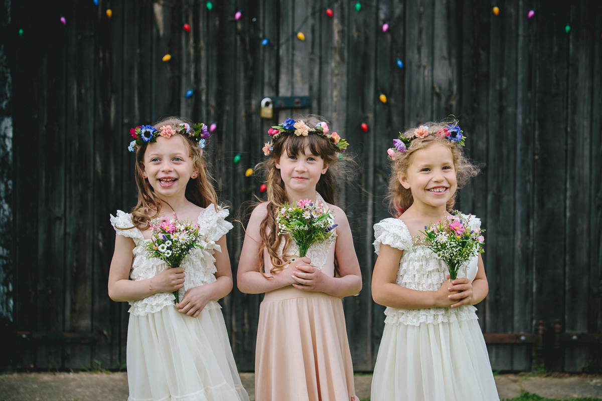 Fran wore a bohemian lace dress for her festival inspired vow renewal held in a meadow. Photography by Joshua Patrick.