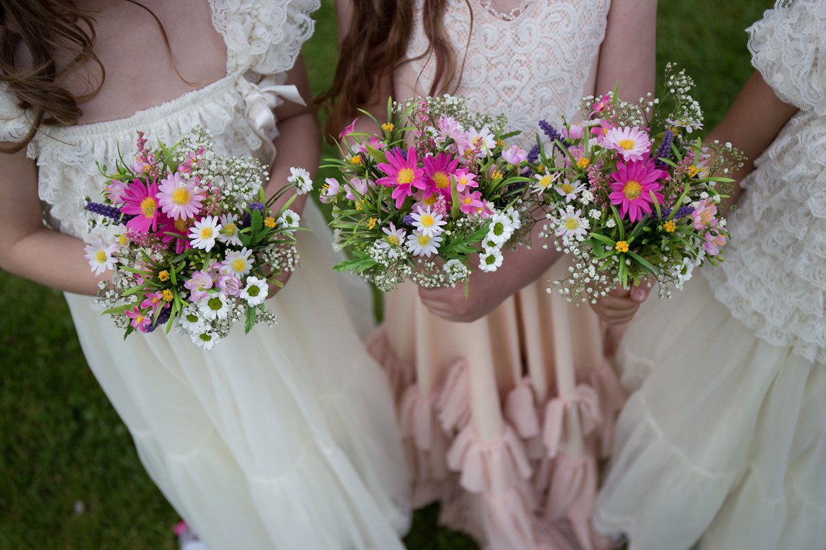 Fran wore a bohemian lace dress for her festival inspired vow renewal held in a meadow. Photography by Joshua Patrick.