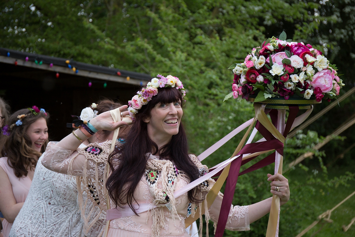 Fran wore a bohemian lace dress for her festival inspired vow renewal held in a meadow. Photography by Joshua Patrick.