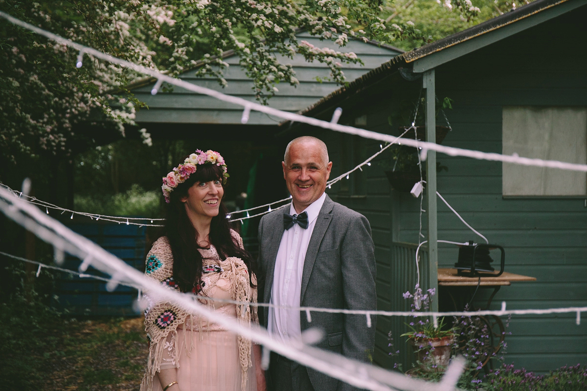 Fran wore a bohemian lace dress for her festival inspired vow renewal held in a meadow. Photography by Joshua Patrick.