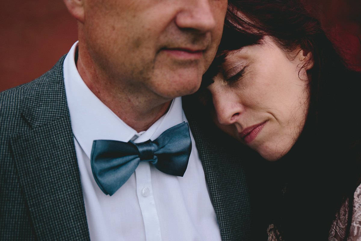 Fran wore a bohemian lace dress for her festival inspired vow renewal held in a meadow. Photography by Joshua Patrick.