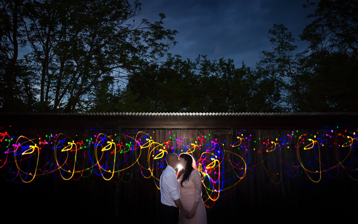 Fran wore a bohemian lace dress for her festival inspired vow renewal held in a meadow. Photography by Joshua Patrick.