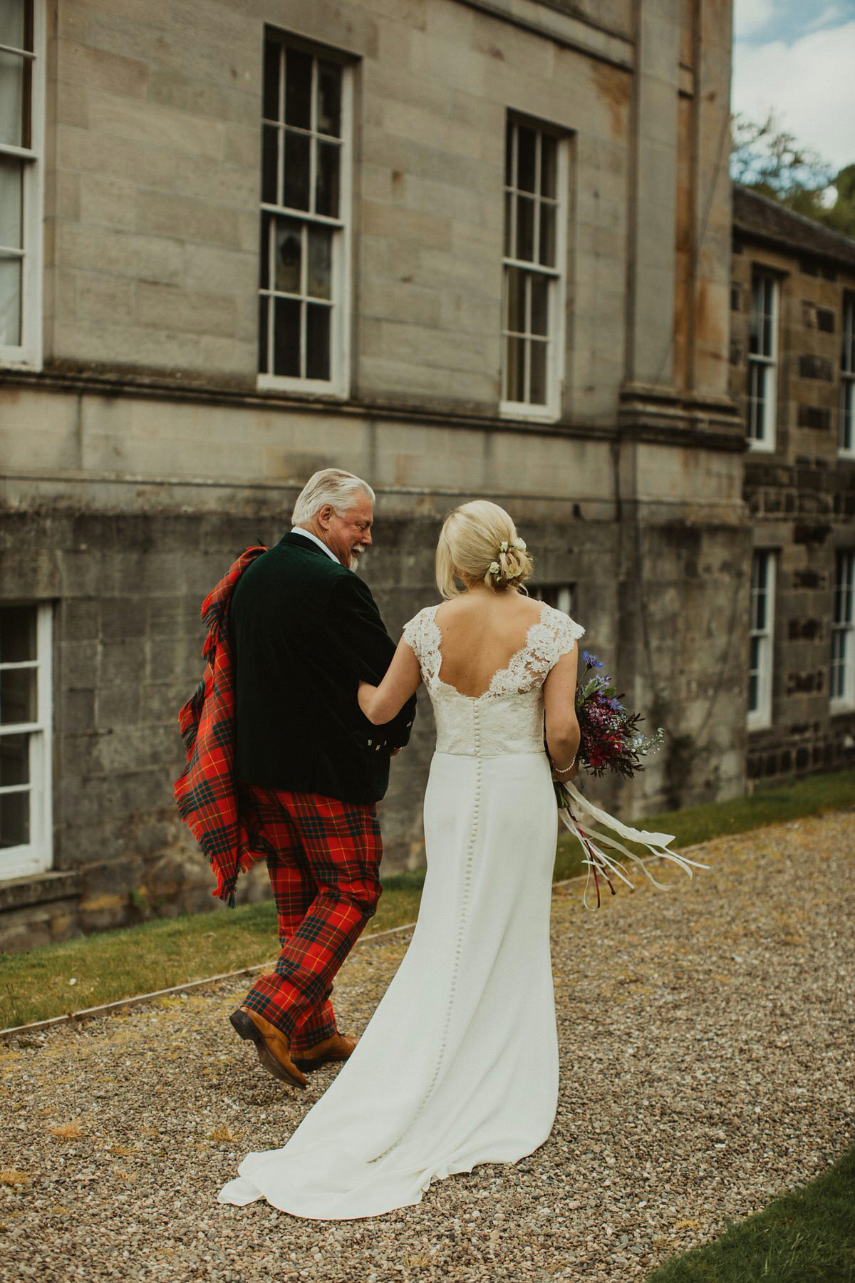 Nicola wears a Stewart Parvin gown for her elegant and romantic 'joining of the clans' inspired Scottish wedding. Photography by The Curries.