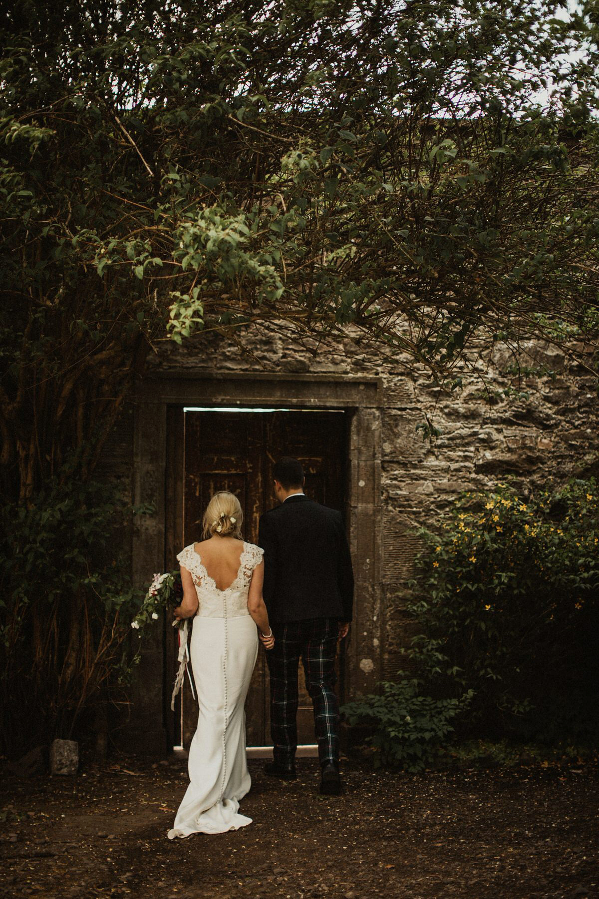 Nicola wears a Stewart Parvin gown for her elegant and romantic 'joining of the clans' inspired Scottish wedding. Photography by The Curries.