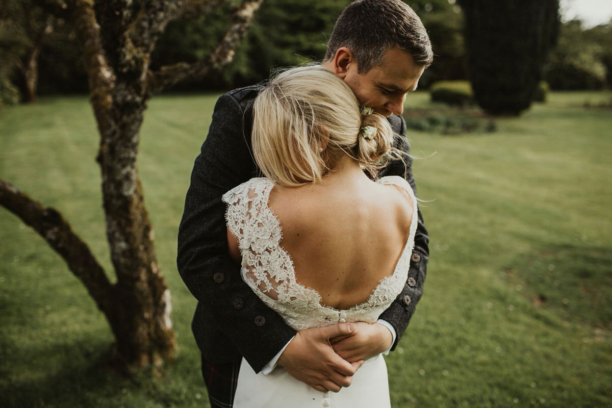 Nicola wears a Stewart Parvin gown for her elegant and romantic 'joining of the clans' inspired Scottish wedding. Photography by The Curries.