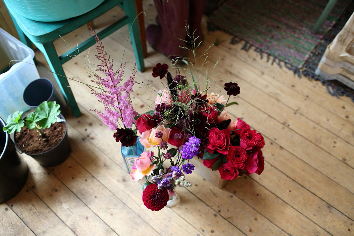 Florist Sam of Violets & Velvet wore a sequin dress by 'Somerset' by Alice Temperley for her colourful and flower-filled village hall wedding. Photography by Rebecca Prigmore.