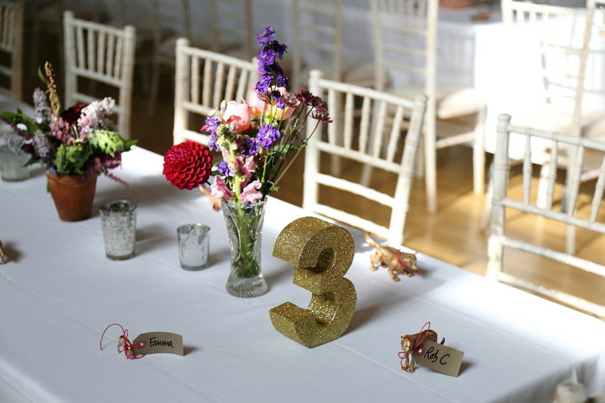 Florist Sam of Violets & Velvet wore a sequin dress by 'Somerset' by Alice Temperley for her colourful and flower-filled village hall wedding. Photography by Rebecca Prigmore.