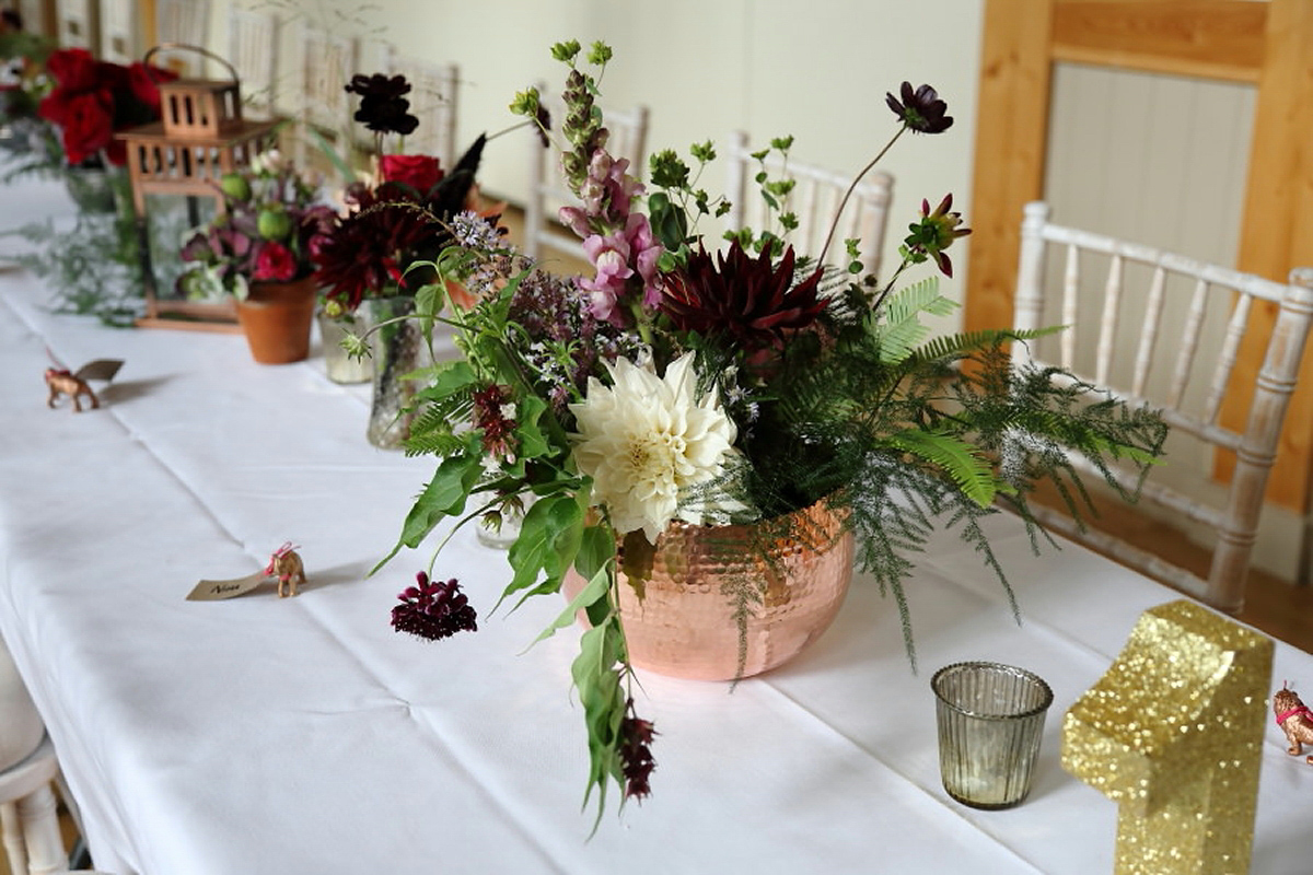 Florist Sam of Violets & Velvet wore a sequin dress by 'Somerset' by Alice Temperley for her colourful and flower-filled village hall wedding. Photography by Rebecca Prigmore.