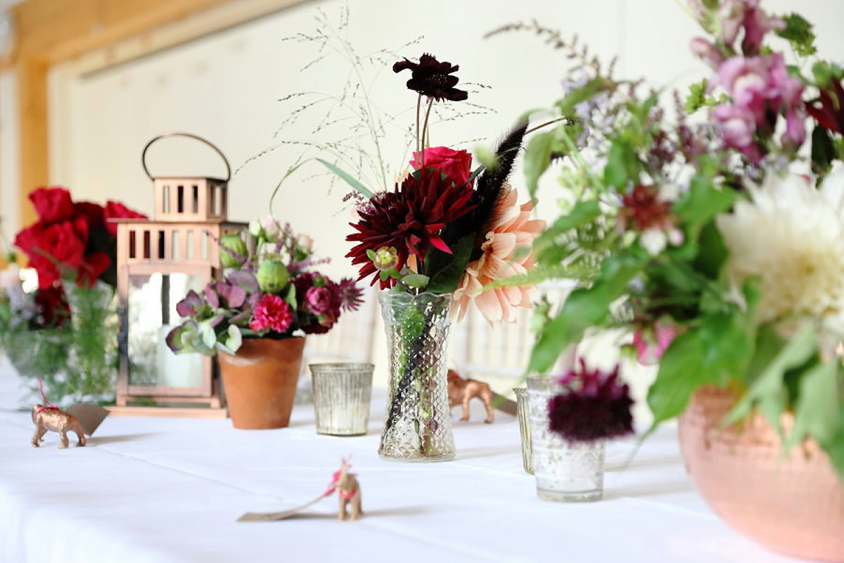 Florist Sam of Violets & Velvet wore a sequin dress by 'Somerset' by Alice Temperley for her colourful and flower-filled village hall wedding. Photography by Rebecca Prigmore.