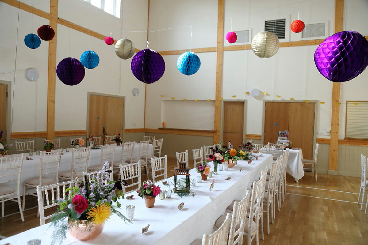 Florist Sam of Violets & Velvet wore a sequin dress by 'Somerset' by Alice Temperley for her colourful and flower-filled village hall wedding. Photography by Rebecca Prigmore.