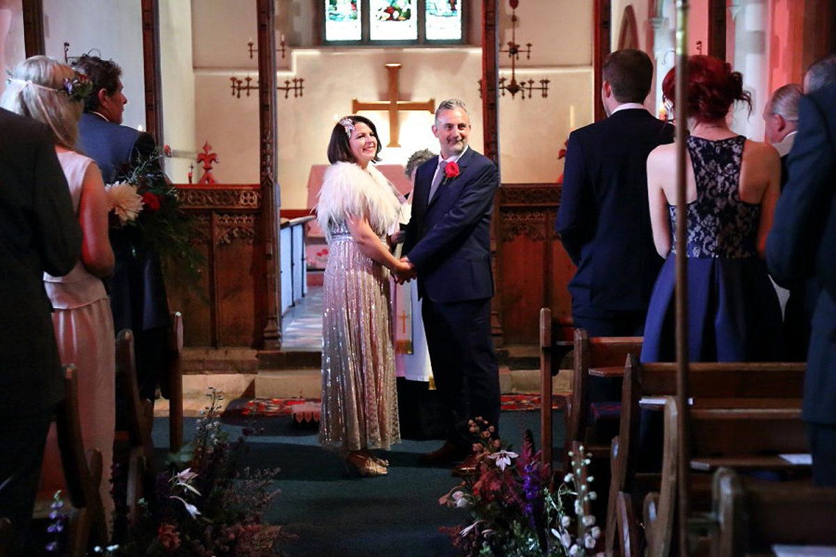 Florist Sam of Violets & Velvet wore a sequin dress by 'Somerset' by Alice Temperley for her colourful and flower-filled village hall wedding. Photography by Rebecca Prigmore.