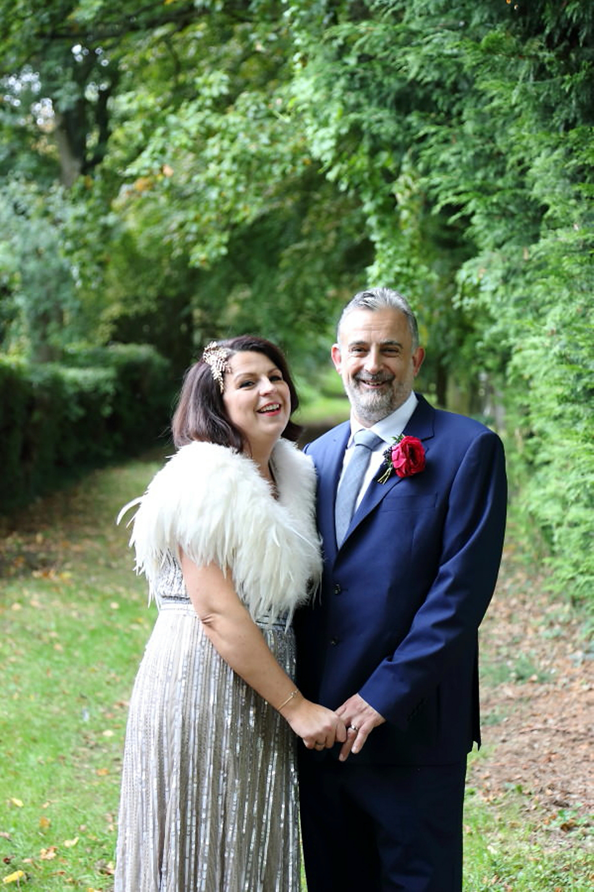 Florist Sam of Violets & Velvet wore a sequin dress by 'Somerset' by Alice Temperley for her colourful and flower-filled village hall wedding. Photography by Rebecca Prigmore.