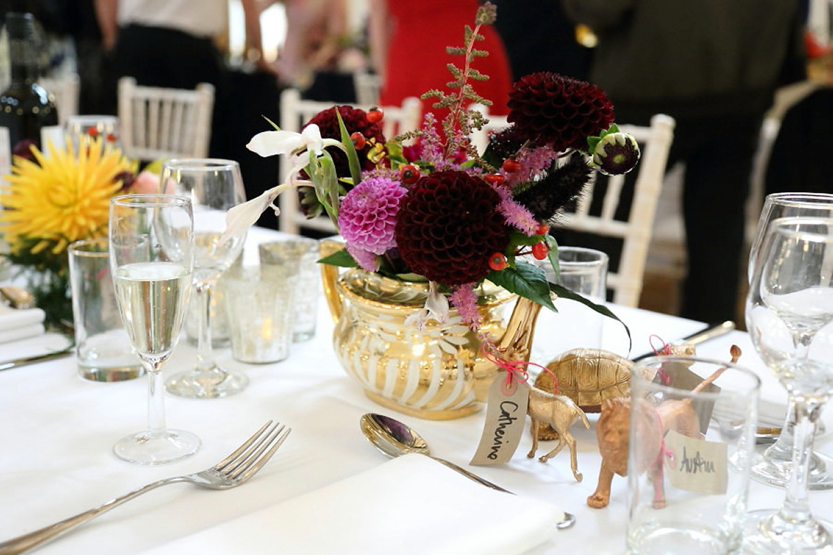 Florist Sam of Violets & Velvet wore a sequin dress by 'Somerset' by Alice Temperley for her colourful and flower-filled village hall wedding. Photography by Rebecca Prigmore.