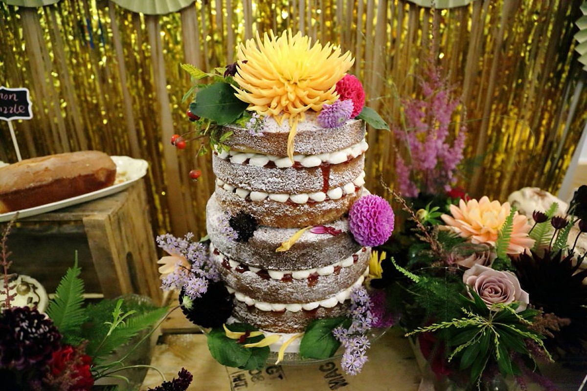 Florist Sam of Violets & Velvet wore a sequin dress by 'Somerset' by Alice Temperley for her colourful and flower-filled village hall wedding. Photography by Rebecca Prigmore.