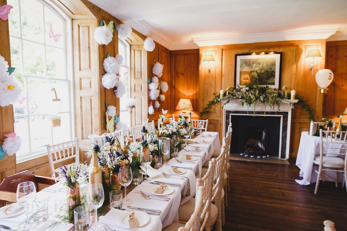 Victoria wears a Pronovias gown with a cathedral length veil for her relaxed, fun and colourful English country garden wedding in the Cotswolds. Photography by Sarah Ann Wright.