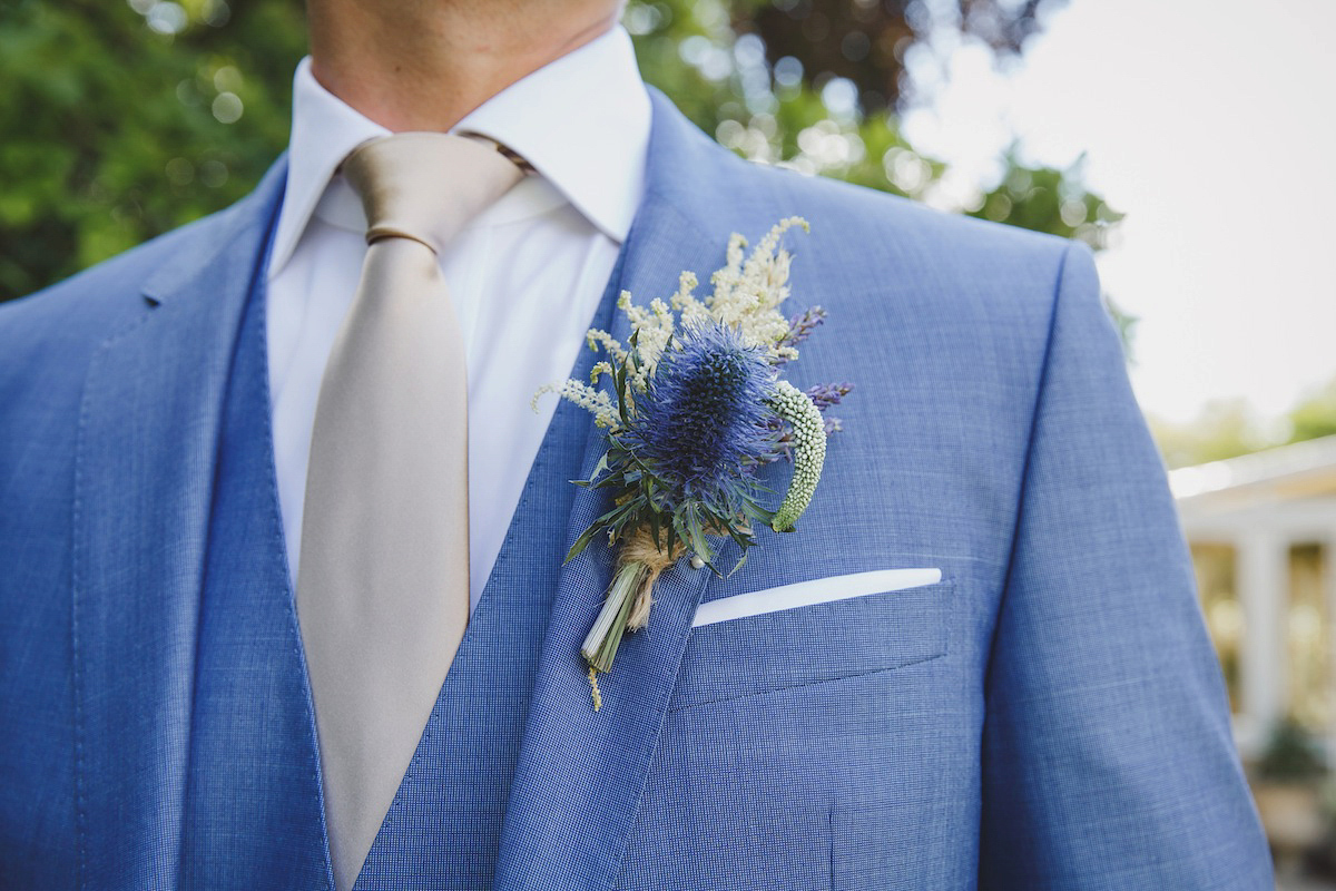 Victoria wears a Pronovias gown with a cathedral length veil for her relaxed, fun and colourful English country garden wedding in the Cotswolds. Photography by Sarah Ann Wright.