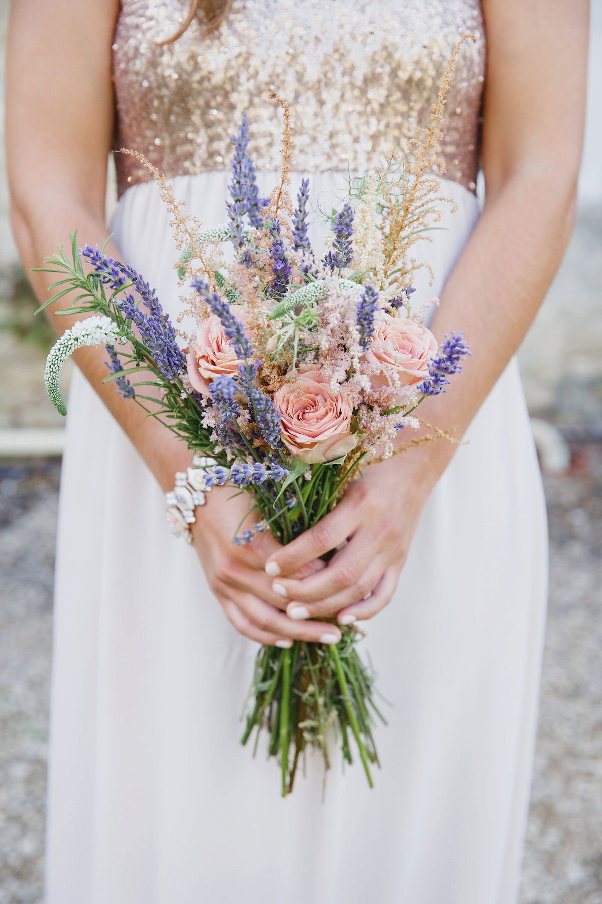 Victoria wears a Pronovias gown with a cathedral length veil for her relaxed, fun and colourful English country garden wedding in the Cotswolds. Photography by Sarah Ann Wright.