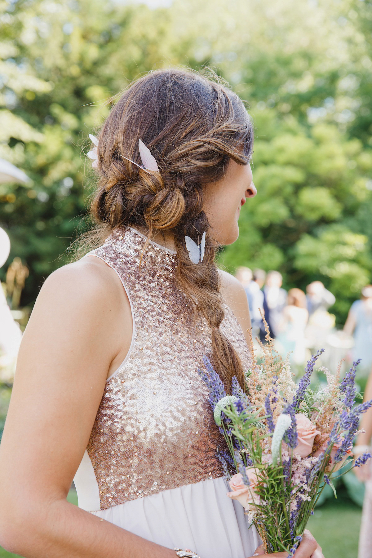 Victoria wears a Pronovias gown with a cathedral length veil for her relaxed, fun and colourful English country garden wedding in the Cotswolds. Photography by Sarah Ann Wright.