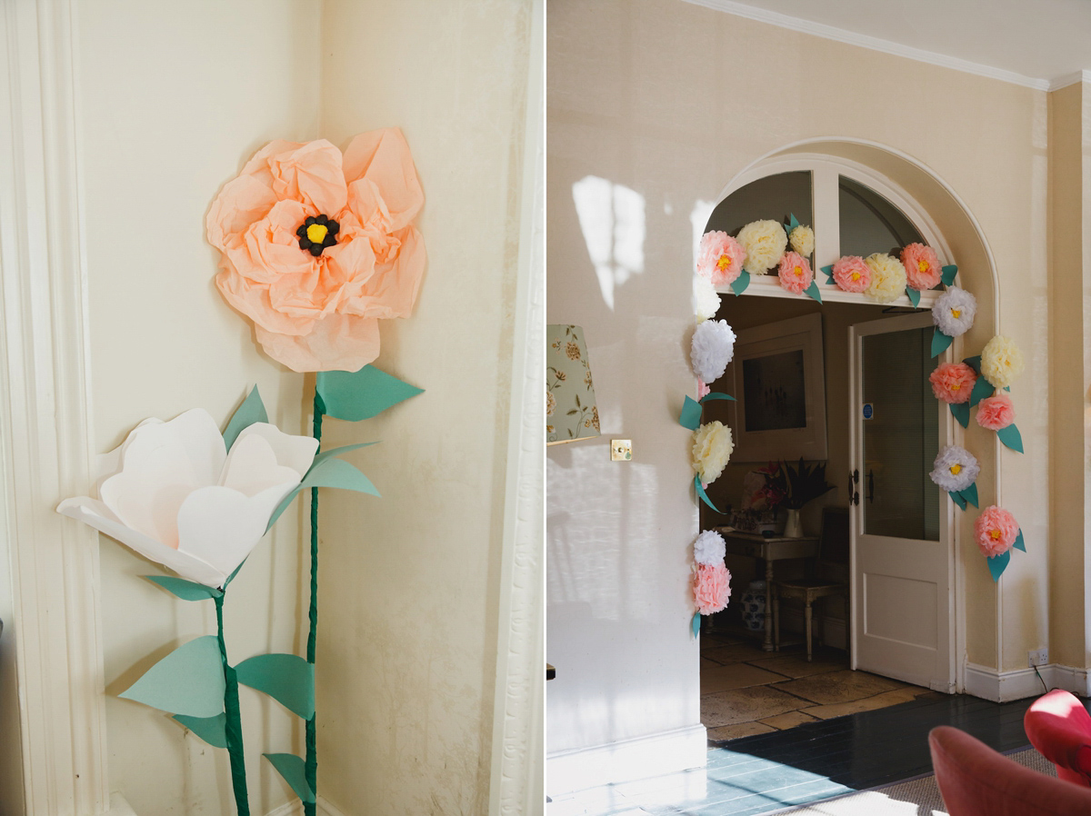 Victoria wears a Pronovias gown with a cathedral length veil for her relaxed, fun and colourful English country garden wedding in the Cotswolds. Photography by Sarah Ann Wright.