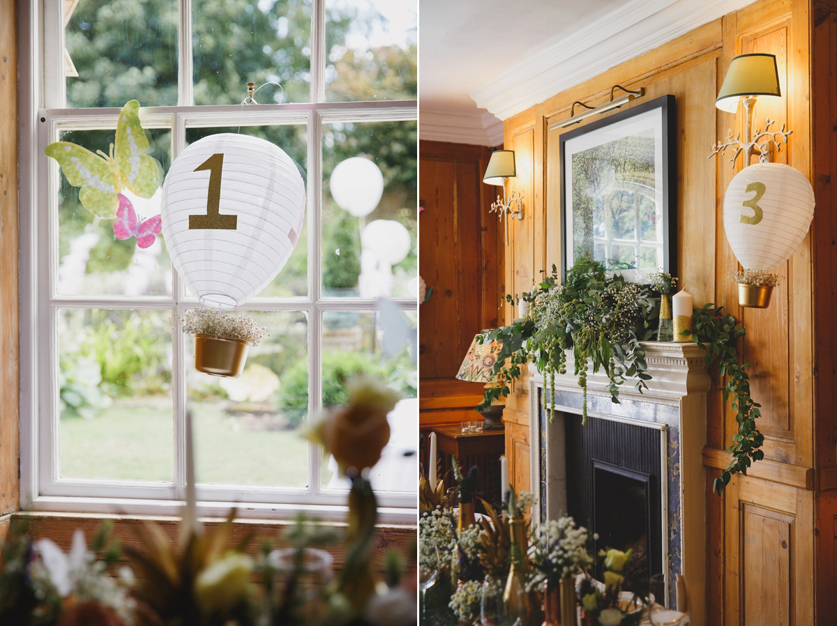 Victoria wears a Pronovias gown with a cathedral length veil for her relaxed, fun and colourful English country garden wedding in the Cotswolds. Photography by Sarah Ann Wright.