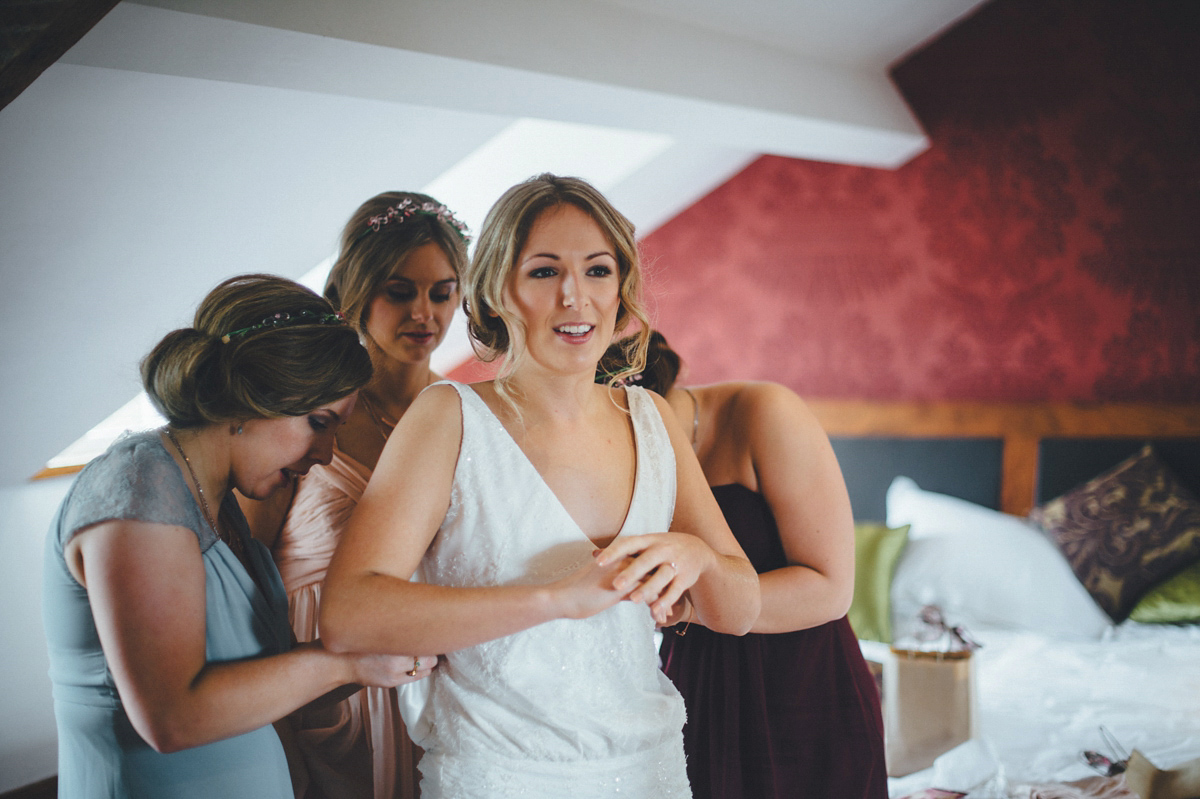 Lucy wore a 1920s inspired drop waist gown by Charlie Brear for her magical Autumn Papakata tipi wedding at Middlesmoor in Yorkshire. Silversixpence Films + Flawless Photography.