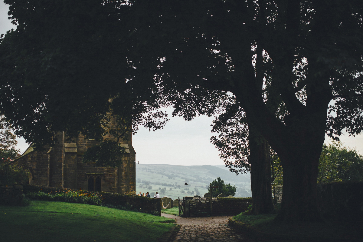 Lucy wore a 1920s inspired drop waist gown by Charlie Brear for her magical Autumn Papakata tipi wedding at Middlesmoor in Yorkshire. Silversixpence Films + Flawless Photography.