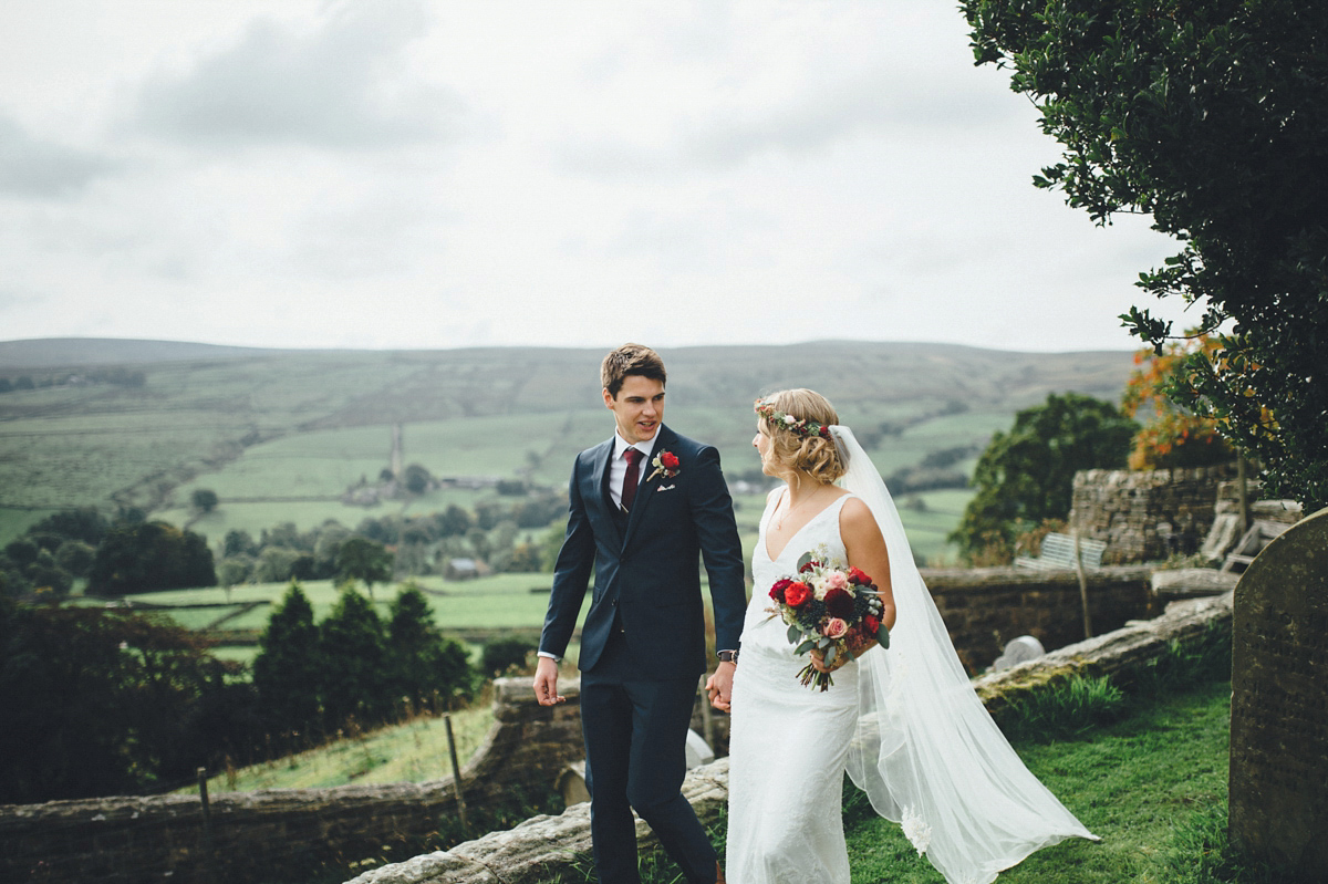 Lucy wore a 1920s inspired drop waist gown by Charlie Brear for her magical Autumn Papakata tipi wedding at Middlesmoor in Yorkshire. Silversixpence Films + Flawless Photography.