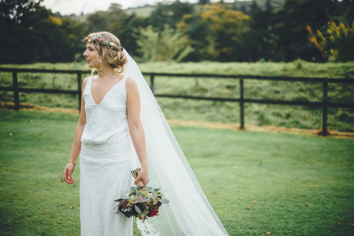 Lucy wore a 1920s inspired drop waist gown by Charlie Brear for her magical Autumn Papakata tipi wedding at Middlesmoor in Yorkshire. Silversixpence Films + Flawless Photography.