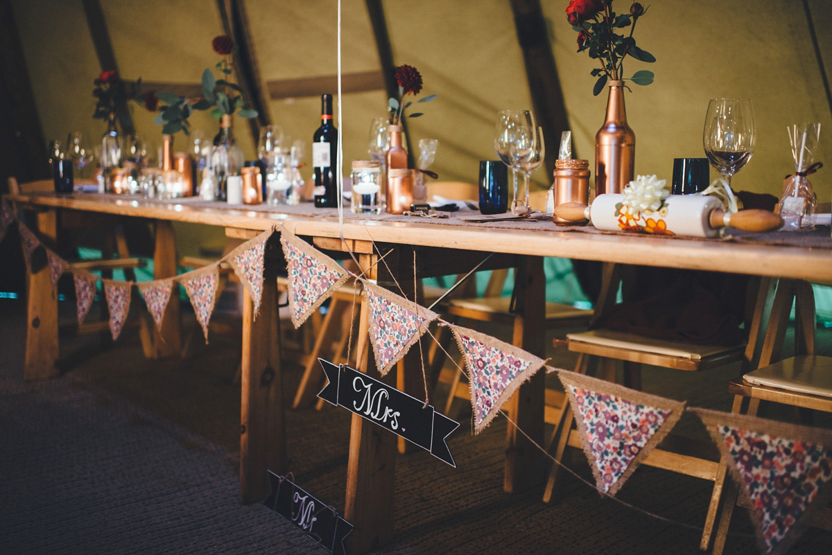 Lucy wore a 1920s inspired drop waist gown by Charlie Brear for her magical Autumn Papakata tipi wedding at Middlesmoor in Yorkshire. Silversixpence Films + Flawless Photography.