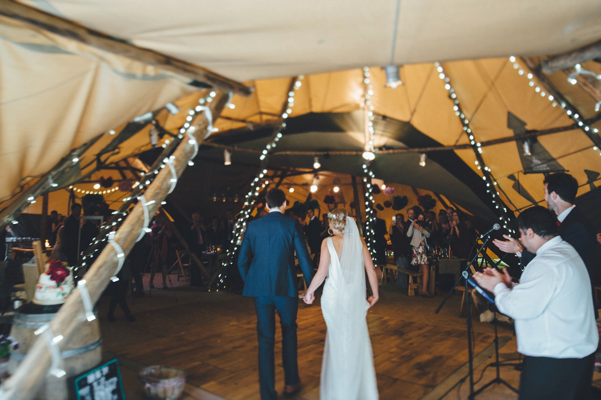 Lucy wore a 1920s inspired drop waist gown by Charlie Brear for her magical Autumn Papakata tipi wedding at Middlesmoor in Yorkshire. Silversixpence Films + Flawless Photography.