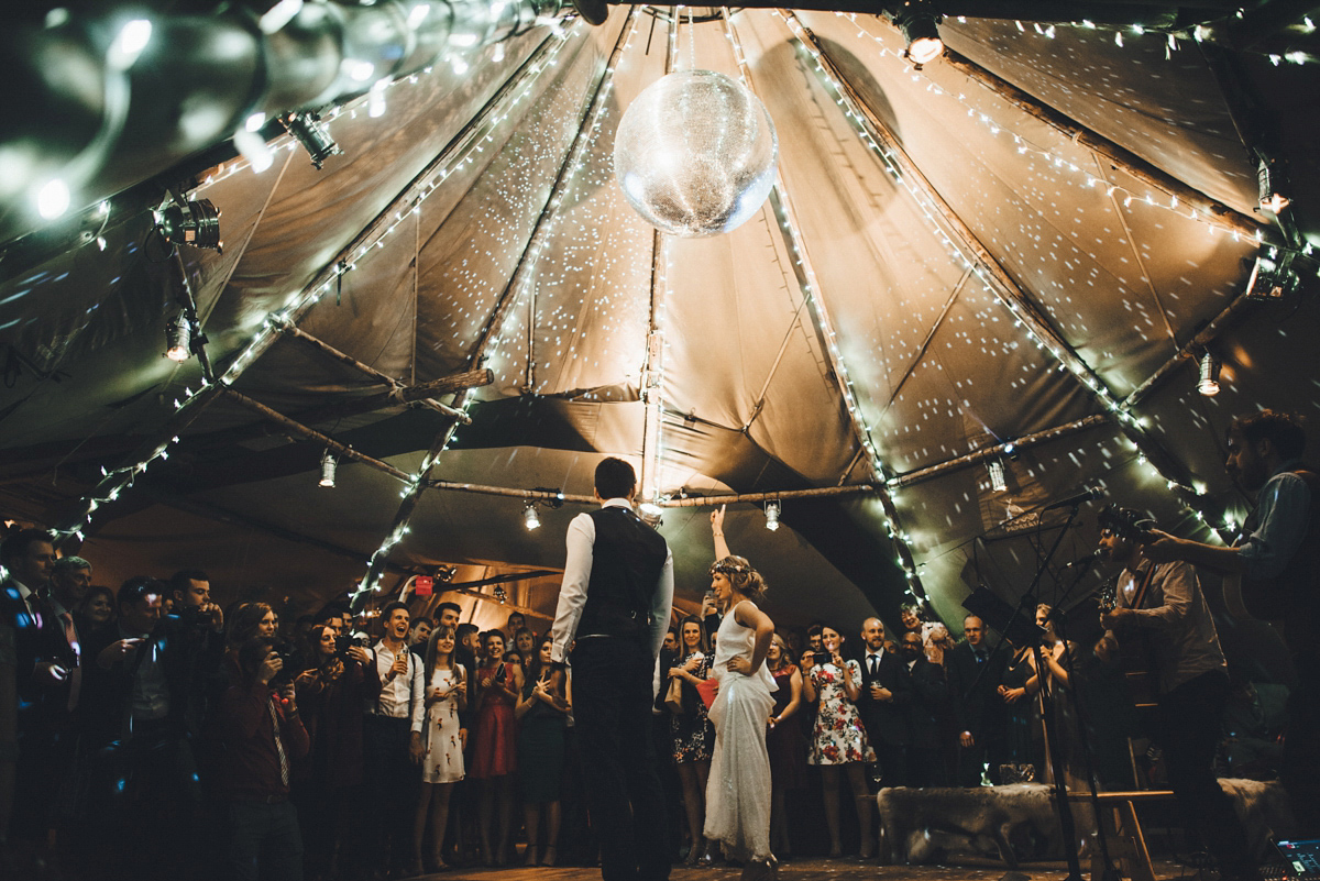 Lucy wore a 1920s inspired drop waist gown by Charlie Brear for her magical Autumn Papakata tipi wedding at Middlesmoor in Yorkshire. Silversixpence Films + Flawless Photography.